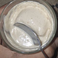A picture of Yogurt ice cream with dates and peanut butter.