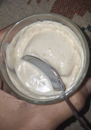 A picture of Yogurt ice cream with dates and peanut butter.