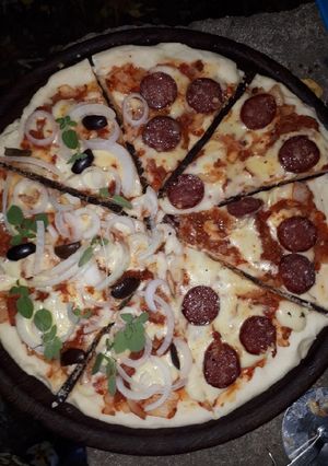 Una foto de Pizza a la tierra
