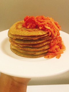 A picture of Over ripe plantain pancake with pepper/tomatoes sauce.