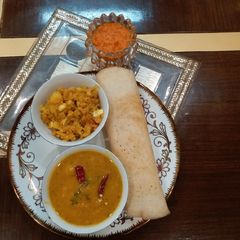 Masala dosa with red chutney A picture of Masala dosa with red chutney.