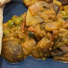 A picture of Mushroom muttar sabzi.