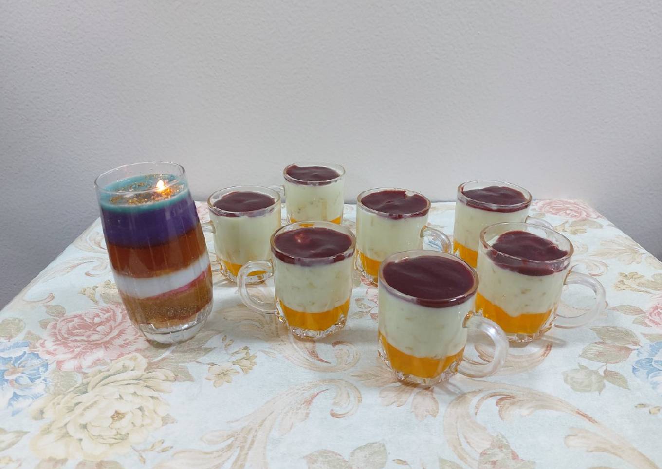 Fruit custard with orange jelly and strawberry palm sauce