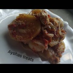 A picture of Fried potatoes in egg.