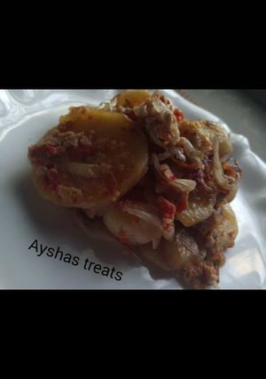 A picture of Fried potatoes in egg.