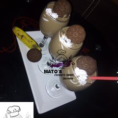 A picture of Oreos and banana smoothie.