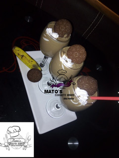 A picture of Oreos and banana smoothie.