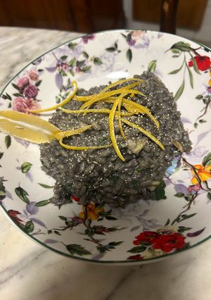 A picture of Instant Squid Ink Risotto with Clams and Lemon Zest.
