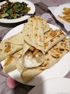 A picture of Chicken Shawarma with Tortilla Bread.