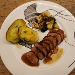 A picture of Tenderloin Steak with grape sauce.
