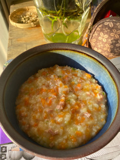 A picture of Congee with Carrot and Sausage.