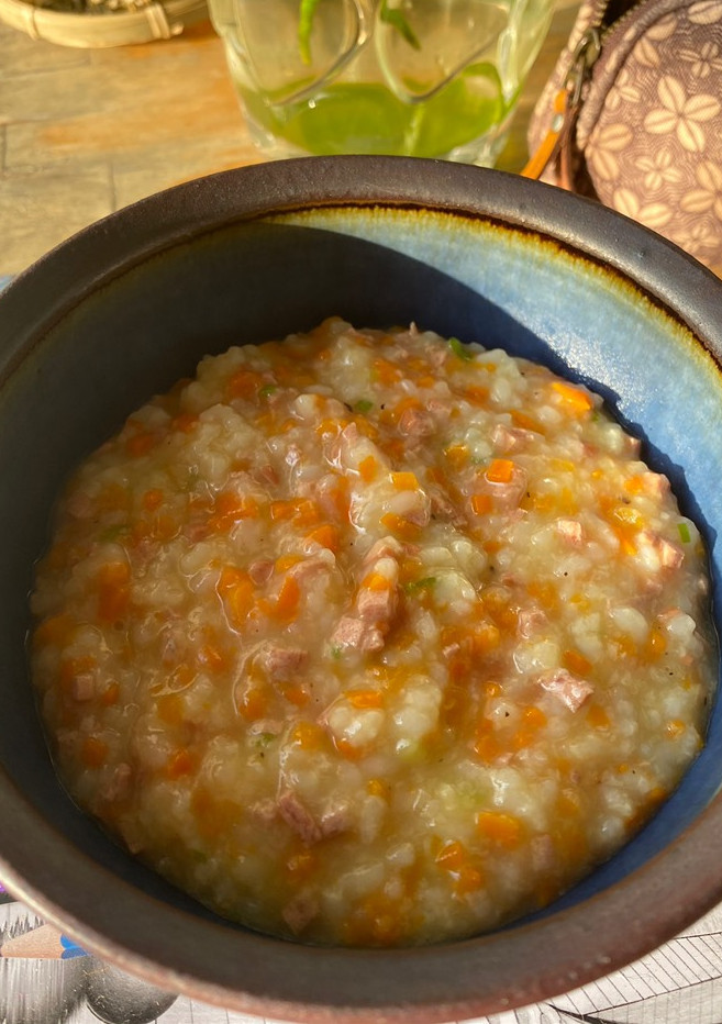 A picture of Congee with Carrot and Sausage.