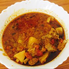 A picture of Spicy Mutton curry.