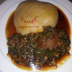 A picture of Water leaf soup with cassava swallow.