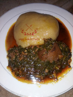 A picture of Water leaf soup with cassava swallow.