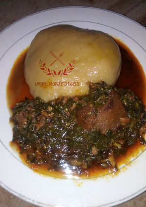 A picture of Water leaf soup with cassava swallow.