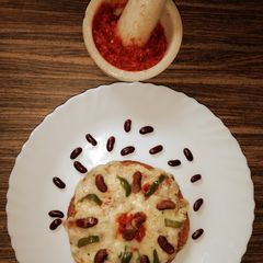 A picture of Rajma Pizza with Garlic Sauce.