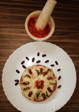 A picture of Rajma Pizza with Garlic Sauce.