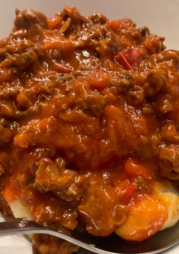 Una foto de Boloñesa con ñoquis