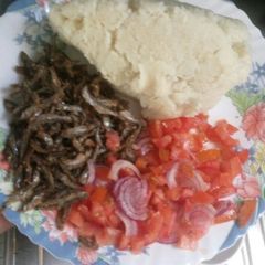 A picture of Fried Omena,Ugali and Kachumbari.