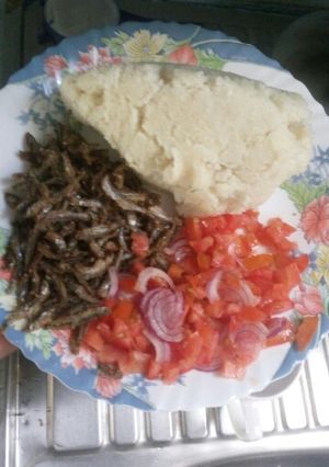A picture of Fried Omena,Ugali and Kachumbari.