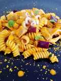 Fusilli con filetto di tonno, calamari, bottarga e vellutata di pomodoro