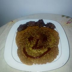 A picture of Pancake with fried meat.