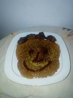 A picture of Pancake with fried meat.
