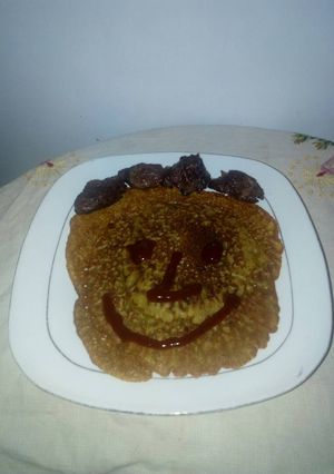A picture of Pancake with fried meat.