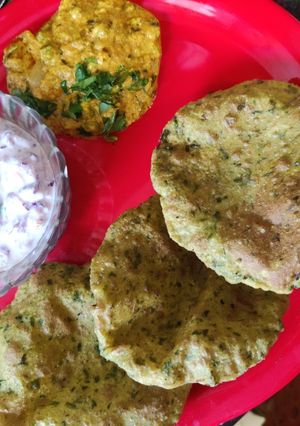 A picture of Bajra methi Puri with mutter shallot and raita.