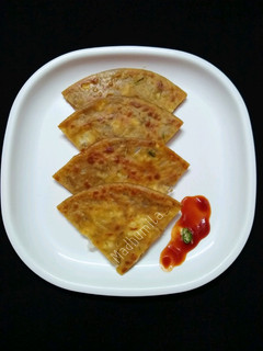 A picture of Paneer Paratha with Italian seasoning.