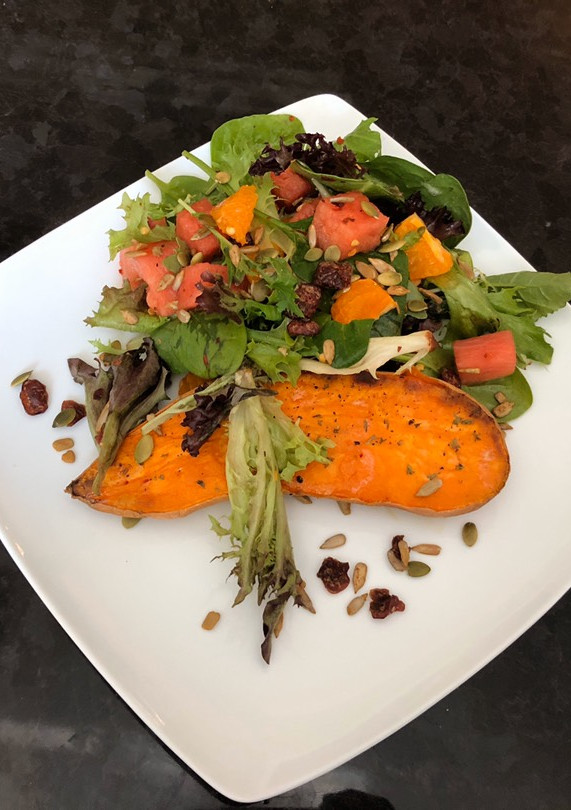 A picture of Baked Sweet Potatoes and Watermelon Green Salad.
