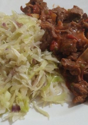 A picture of Fried cabbages with wet fried beef.