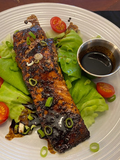 A picture of Salmon with Balsamic Reduction Sauce.