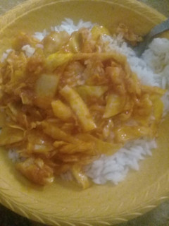 A picture of White rice with cabbage sauce.