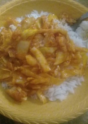 A picture of White rice with cabbage sauce.