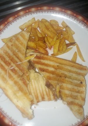 A picture of Grilled Potato sandwich with cheese.