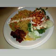 A picture of Jellof rice and salad.