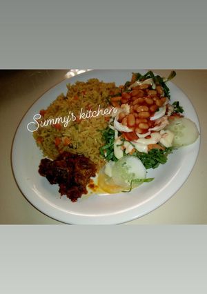 A picture of Jellof rice and salad.