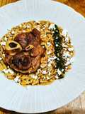 Pork osso buco, saffron orzo, tangerine gremolata and feta