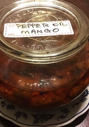 A picture of California Farm Green Mangos Pickled in Pepper Oil.