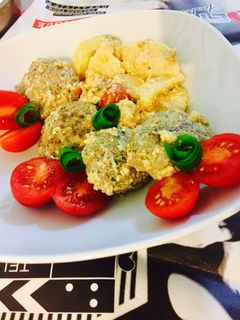 A picture of Kofta with Tahini Sauce.