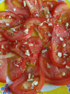 Una foto de Aliño de tomate y orégano