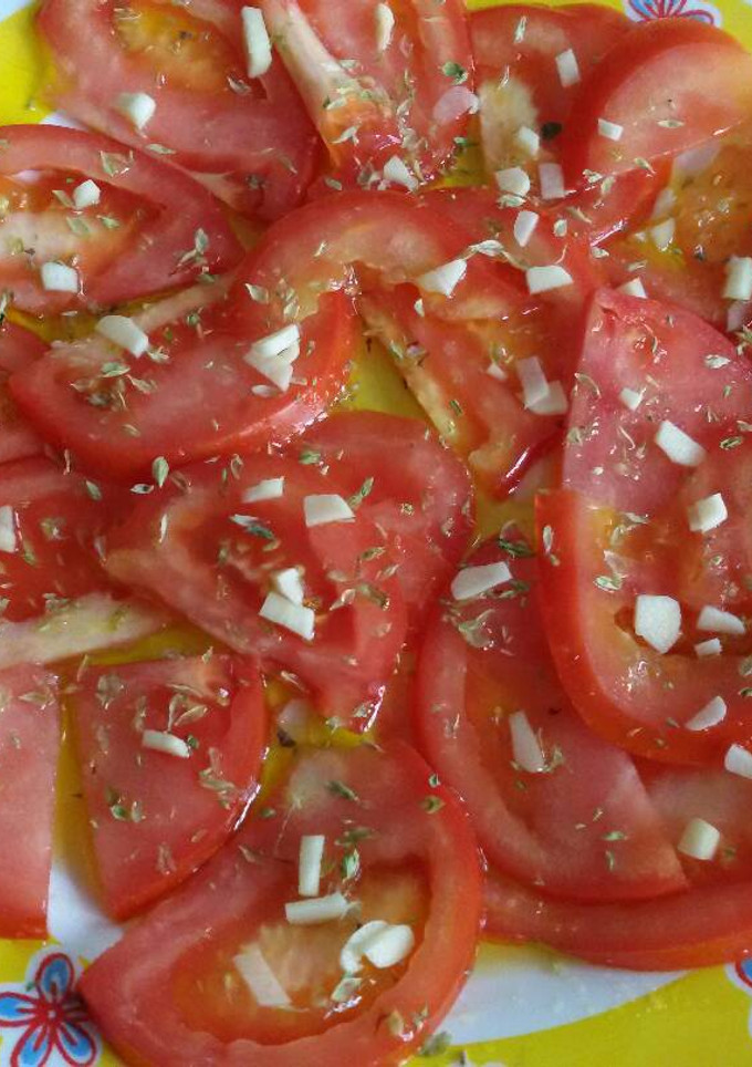 Una foto de Aliño de tomate y orégano