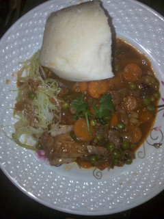 A picture of Beef stew and steamed cabbage.