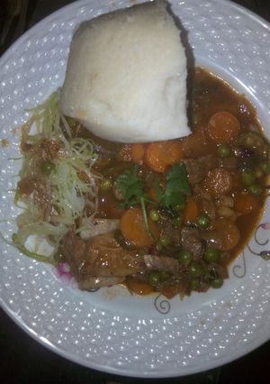 A picture of Beef stew and steamed cabbage.