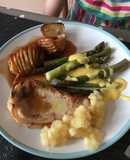Brined Pork Chops with Hasselback Potatoes, tender, buttery Asparagus and sharp Hollandaise Sauce