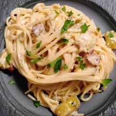 A picture of Zucchini and bacon spaghetti.