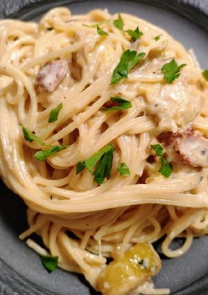 A picture of Zucchini and bacon spaghetti.