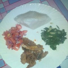 A picture of Ugali,, beef and steamed spinanch.